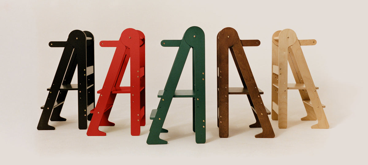 The Piccalio Foldable Tower in five different beautiful colors including a Walnut stain