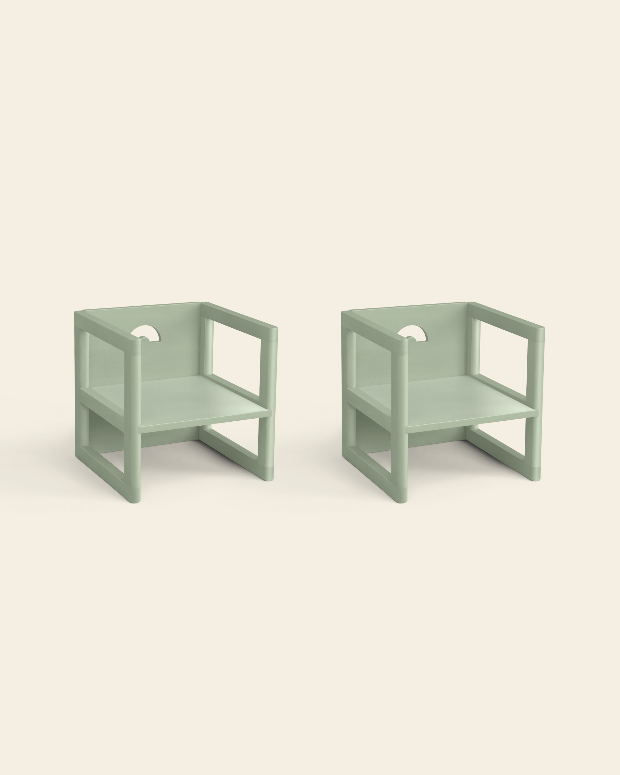 Two wooden children's chairs in sage color