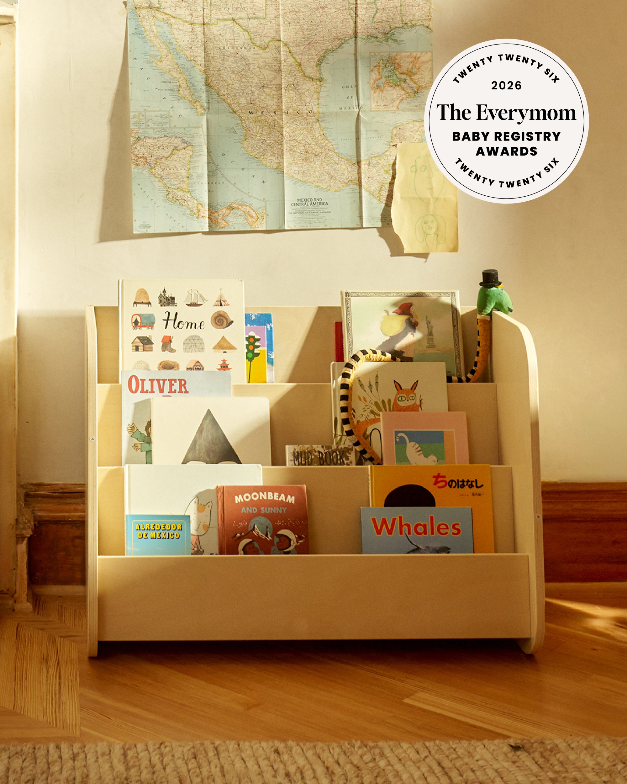 Piccalio Montessori bookshelf with front facing book display made from non toxic wood used in toddler playroom