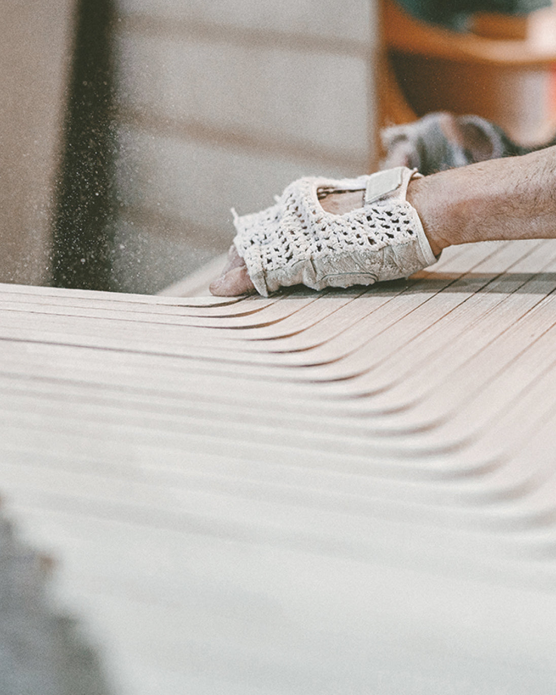 person doing quality control checks on natural wood kids furniture