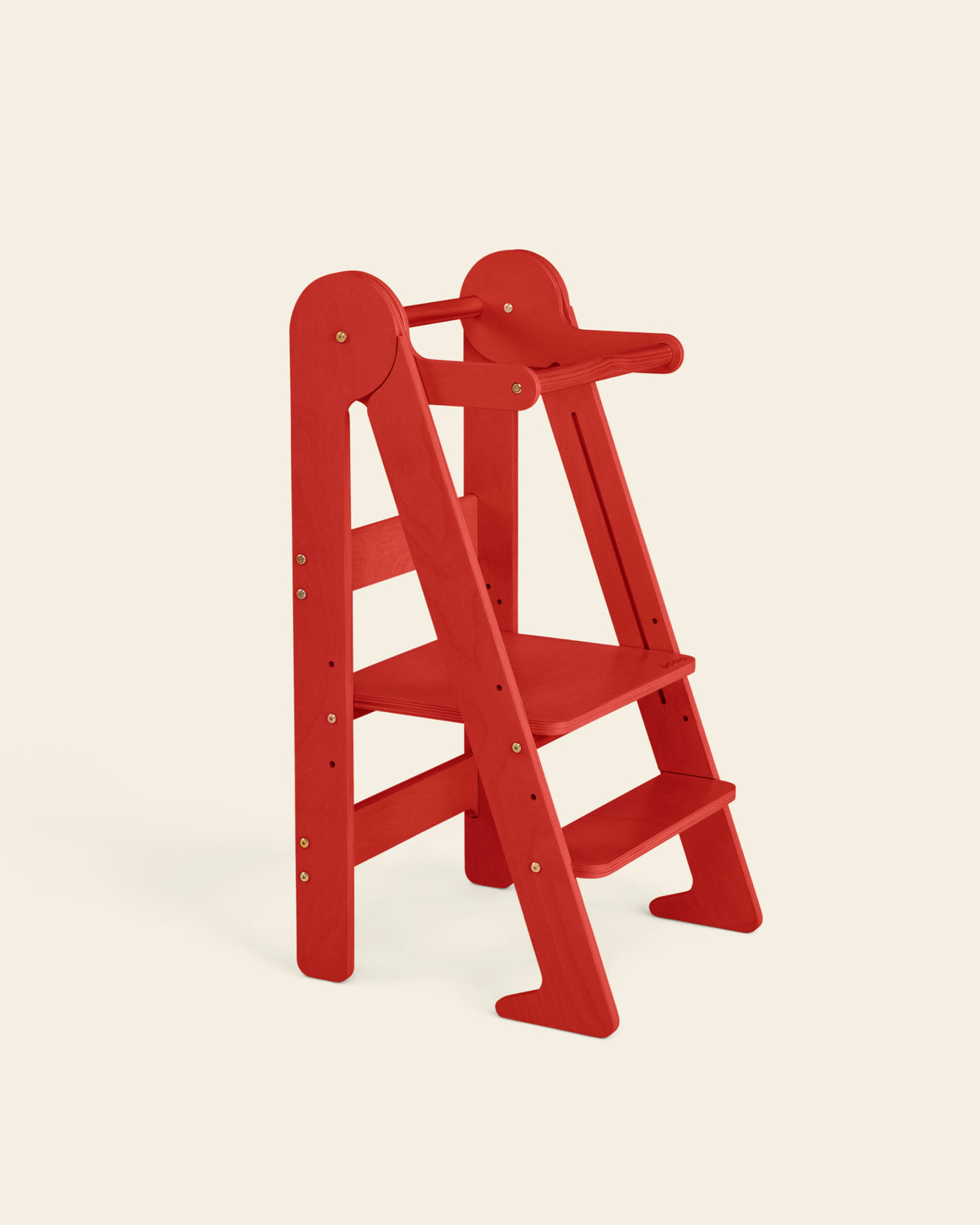 Piccalio Foldable Toddler Tower made of natural birch wood in a bold red stain featuring an adjustable standing platform.