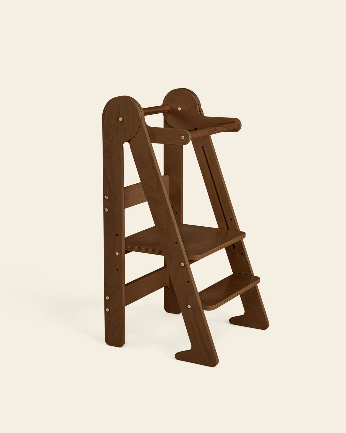 Piccalio Foldable Toddler Tower made of natural birch wood in a walnut stain featuring an adjustable standing platform.