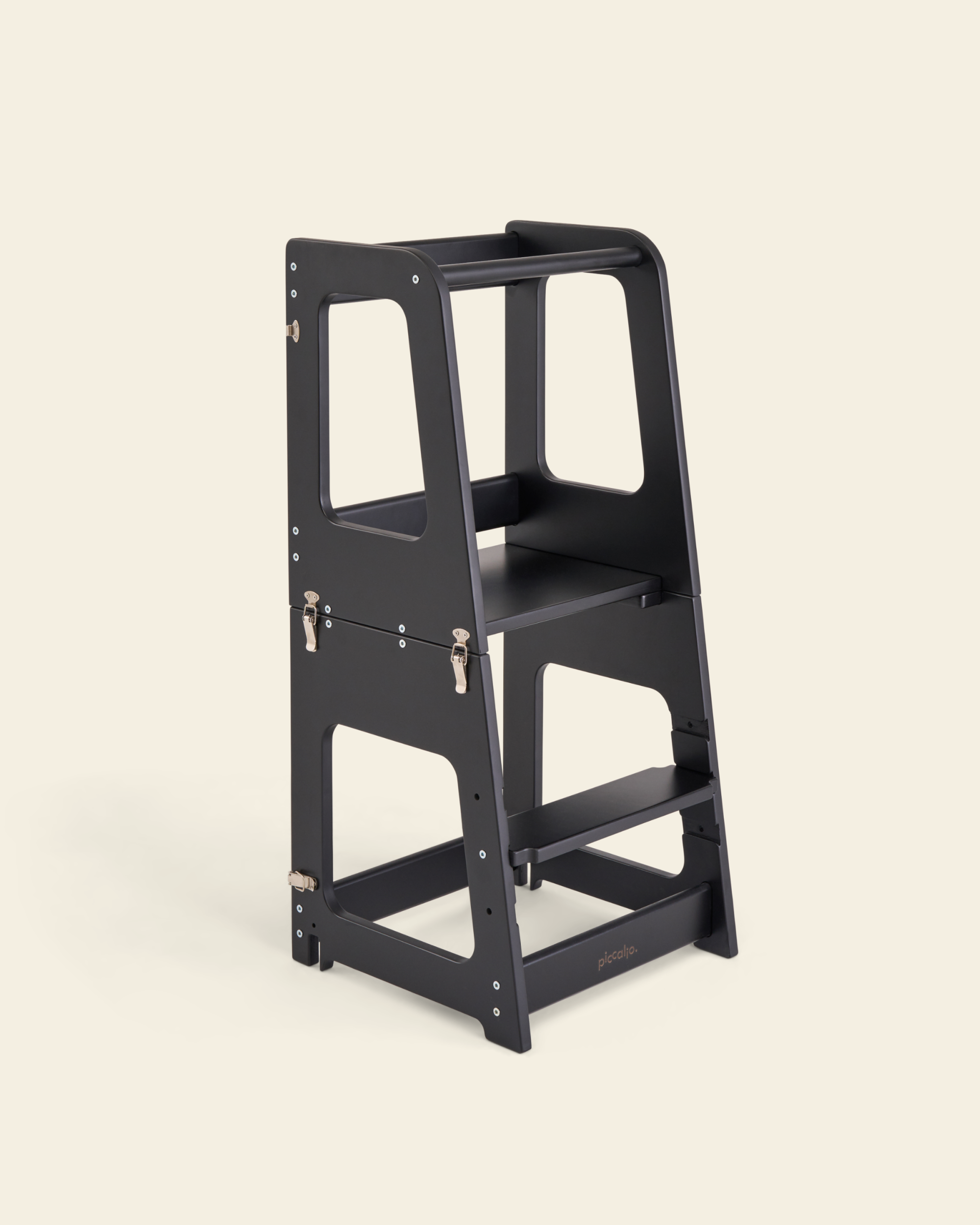 Piccalio convertible toddler tower made of birch wood in a black finish.