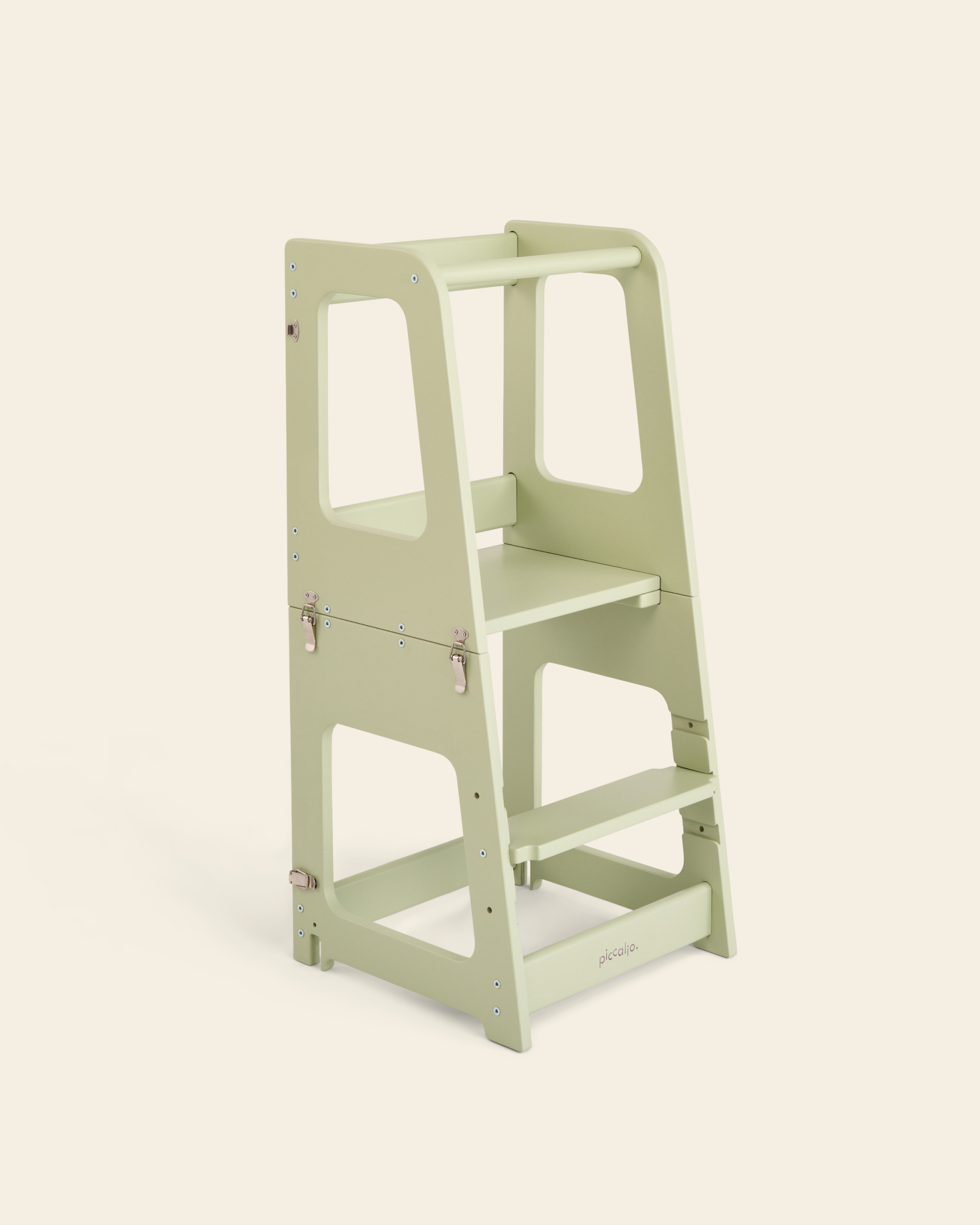 Piccalio convertible toddler tower made of birch wood in a sage green finish.