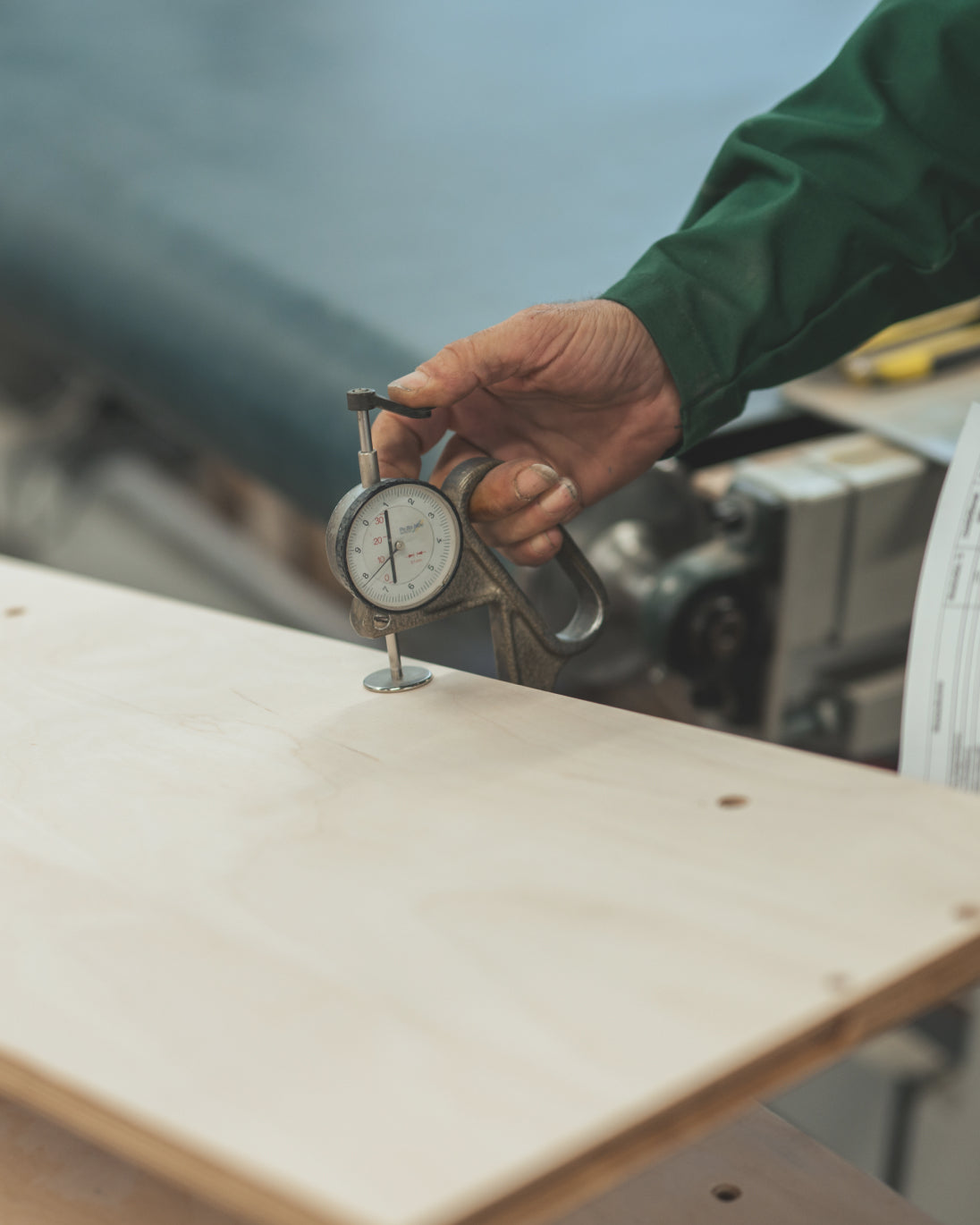 person doing quality control check on solid wood furniture for children