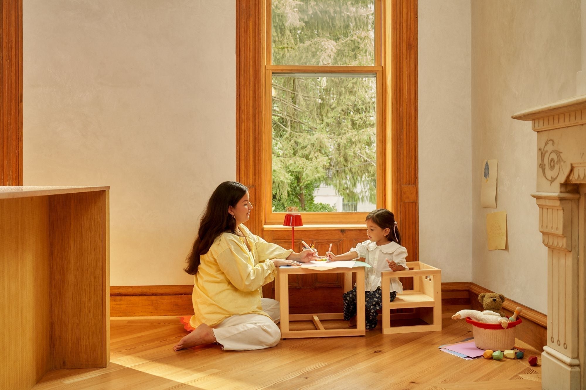 mom and child drawing at a Montessori table and chairs in the kitchen, weaning table