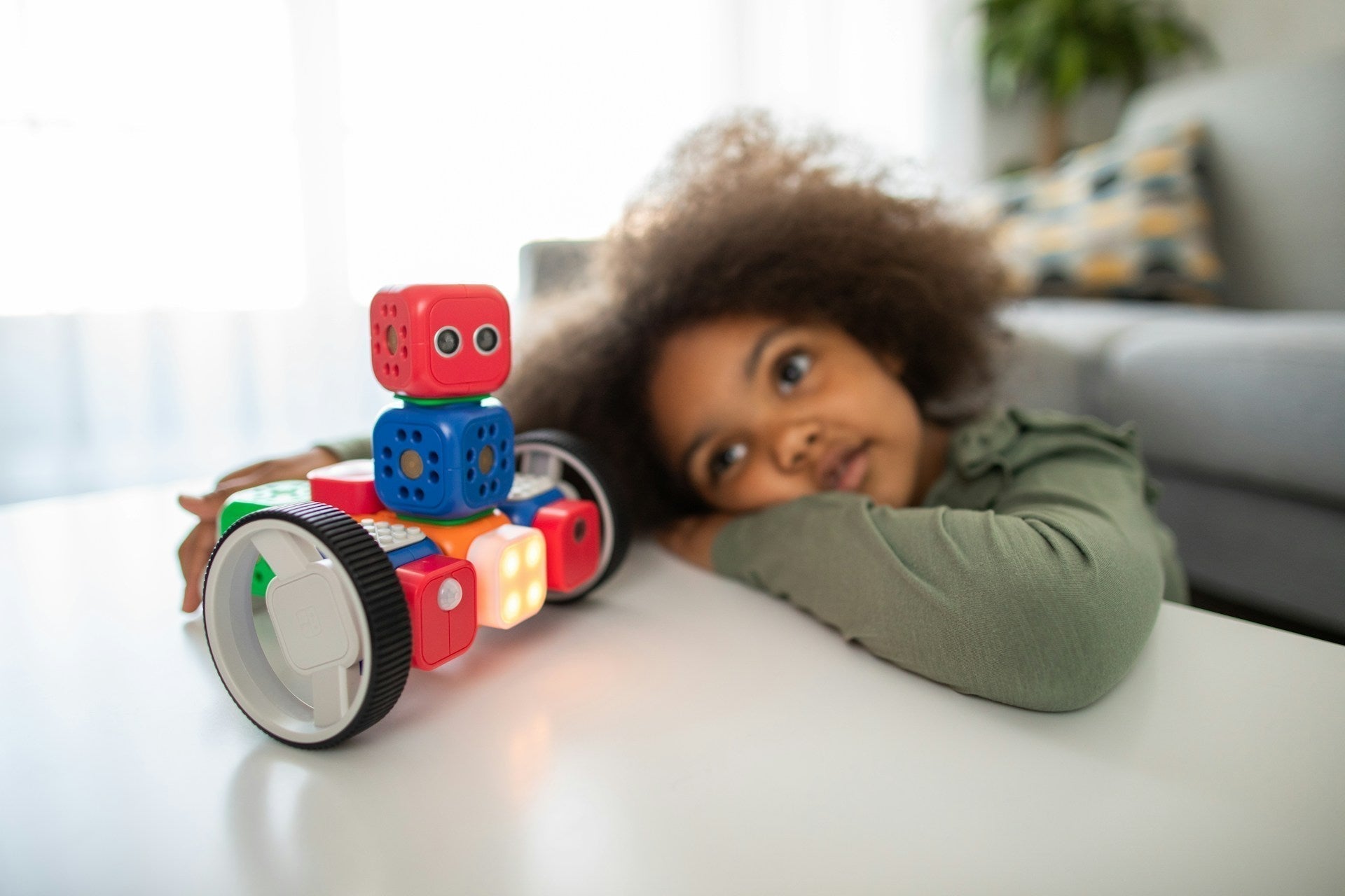 Child looking at an robot AI toy for kids