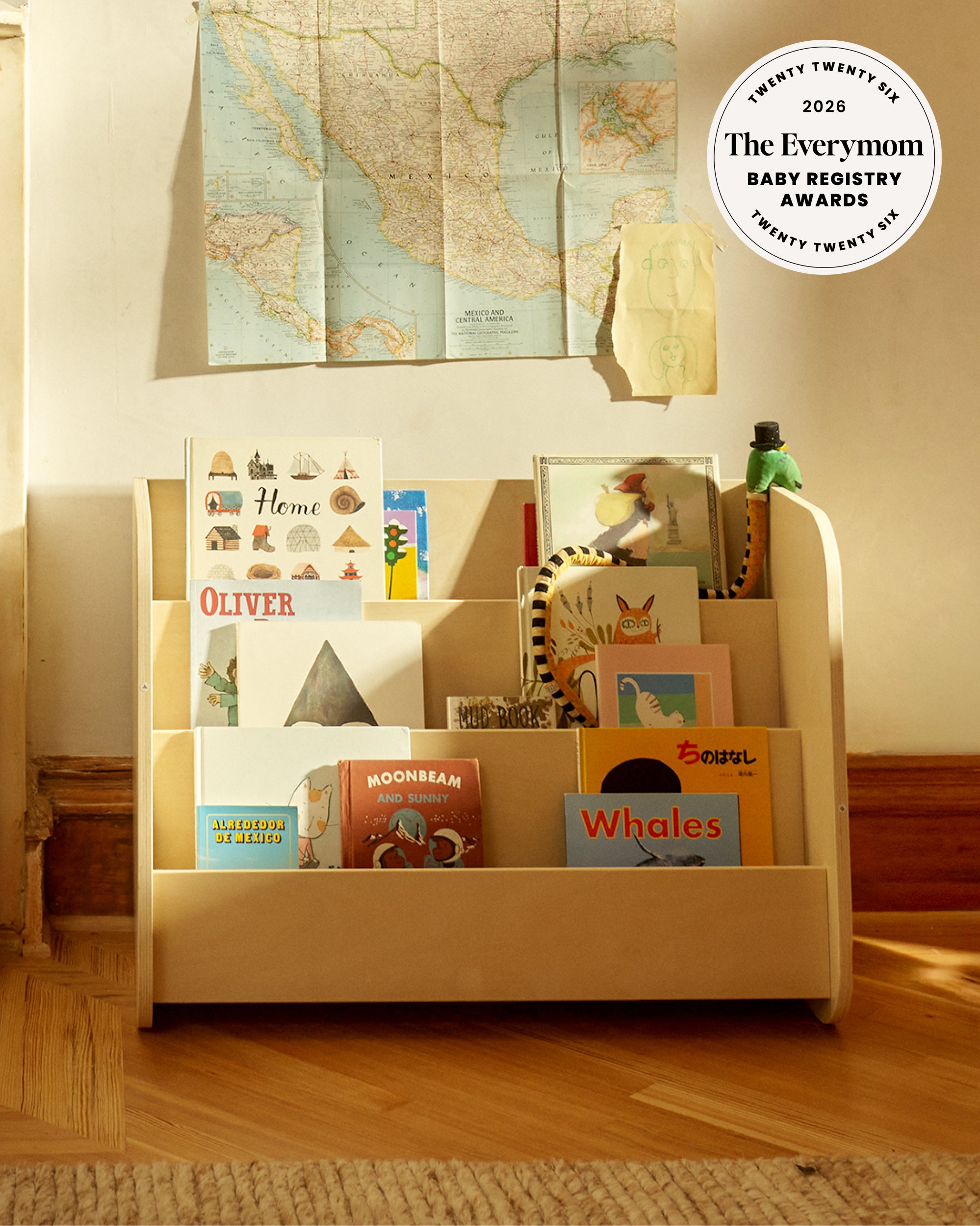 Piccalio Montessori bookshelf with front facing book display made from non toxic wood used in toddler playroom