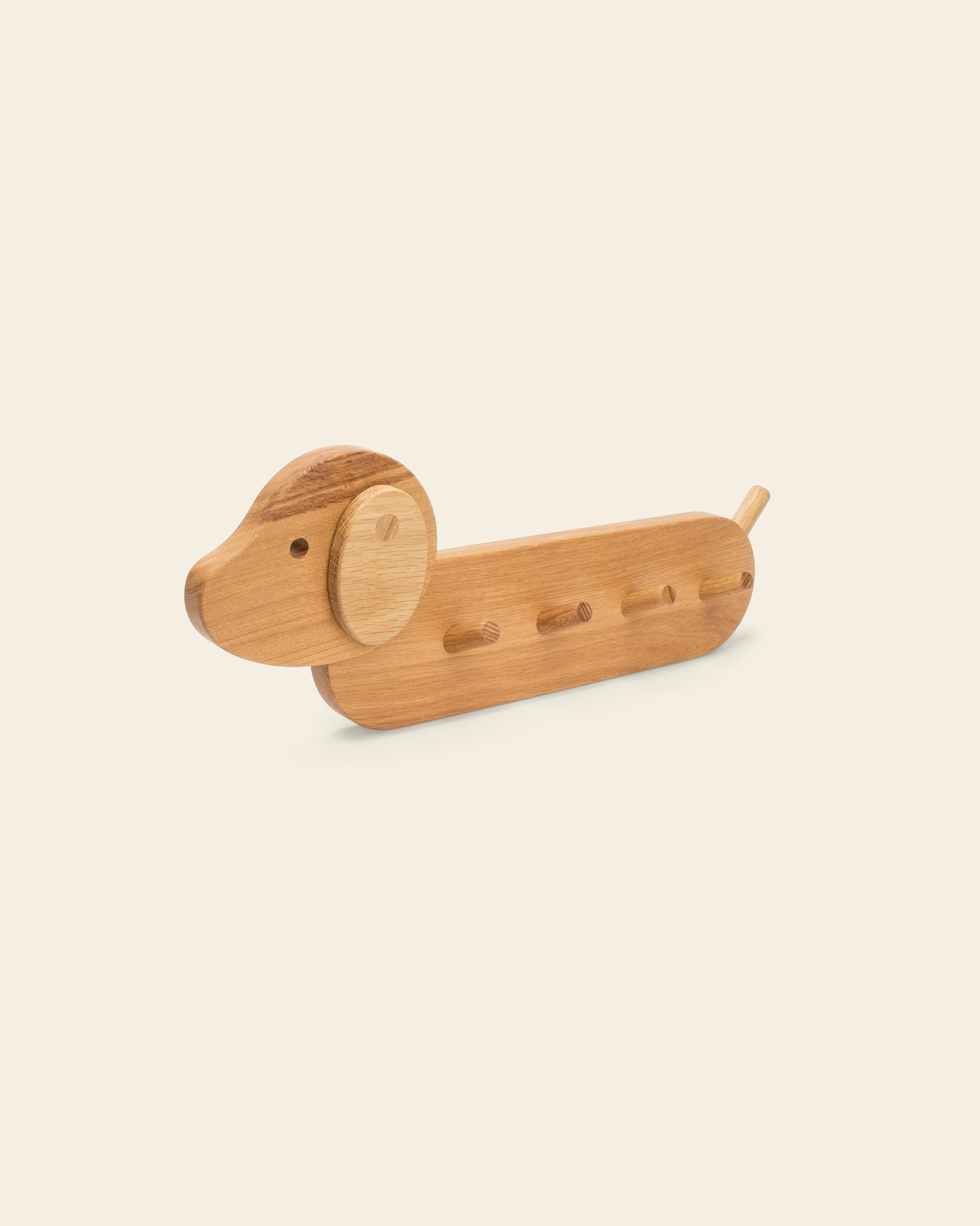 Detailed view of the dog style Piccalio Coat Rack for children made of sustainably sourced natural wood