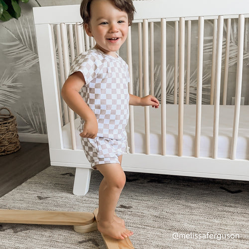 Boy plays on Montessori balance beam by piccalio in nursery for toddler