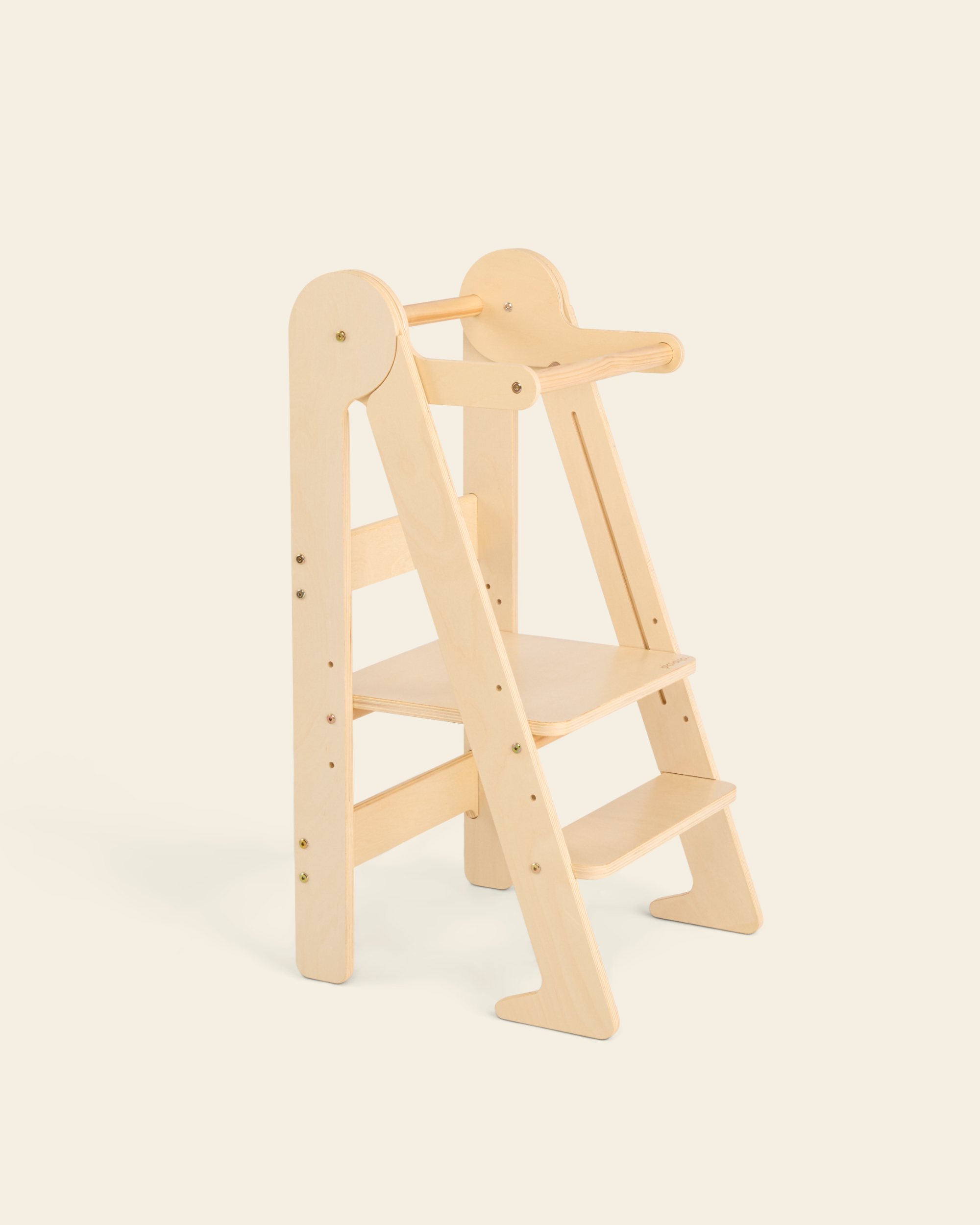 Piccalio wooden foldable toddler tower in a natural finish — a height-adjustable Montessori toddler tower designed to provide a safe and stable platform for kitchen participation.